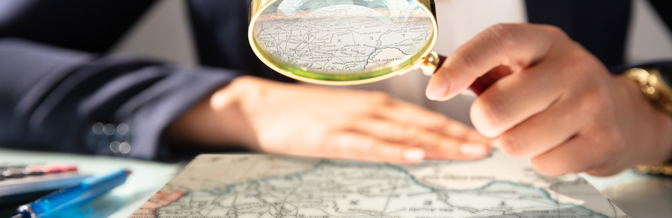 Magnifying glass over map